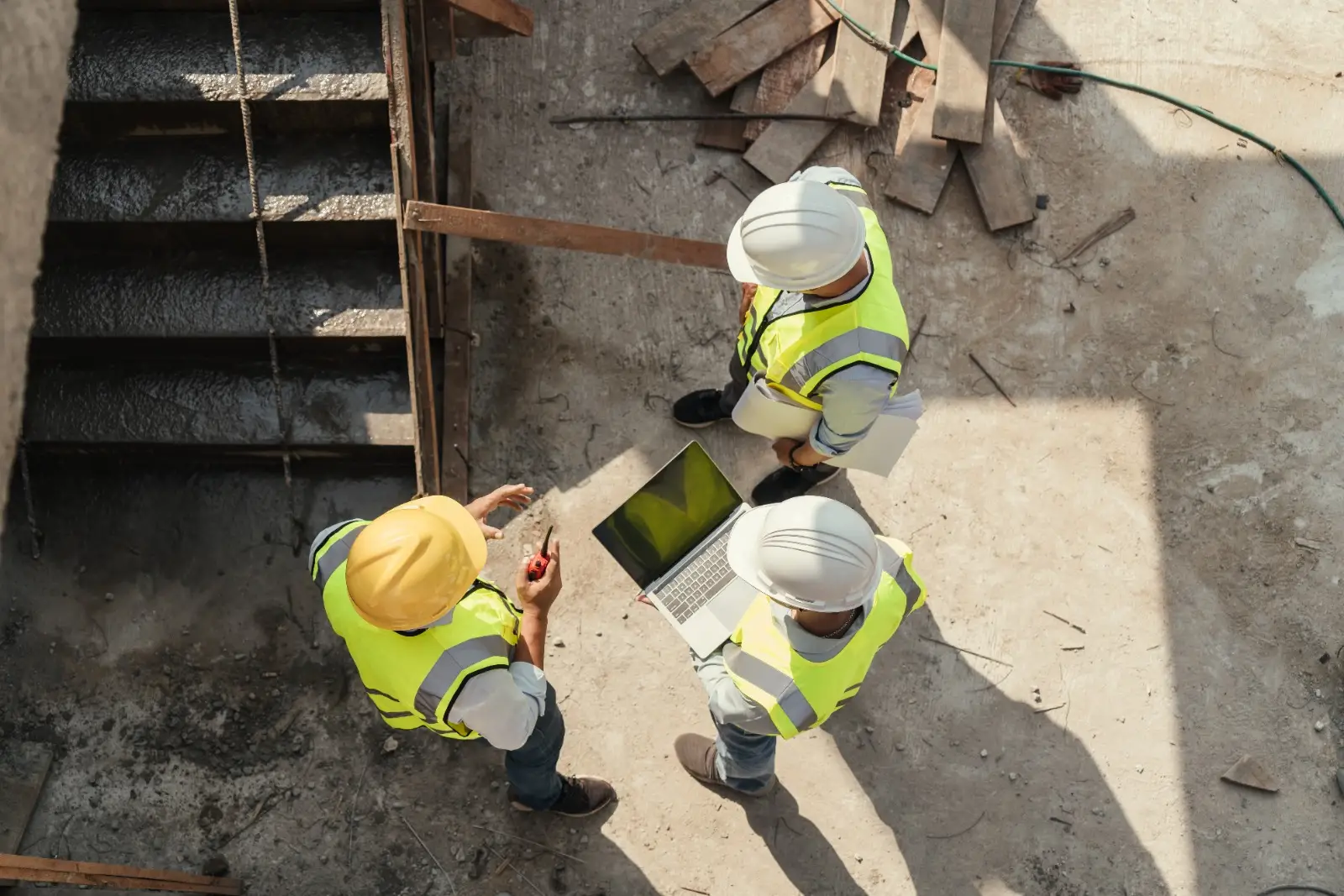 Inspectors reviewing new construction work on site during a stage inspection